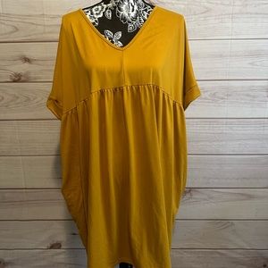 This dress is made of the buttery legging type fabric. It also has pockets.